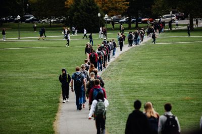 students walk across drillfield 